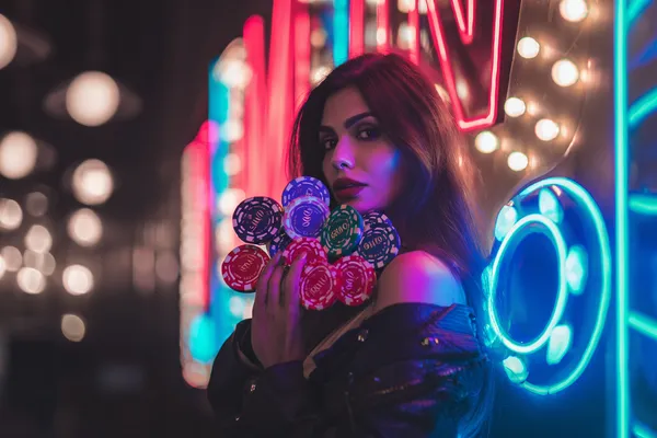 A woman in a luxurious green gown next to an ornate roulette wheel, capturing the upscale casino mood of JLMMM.